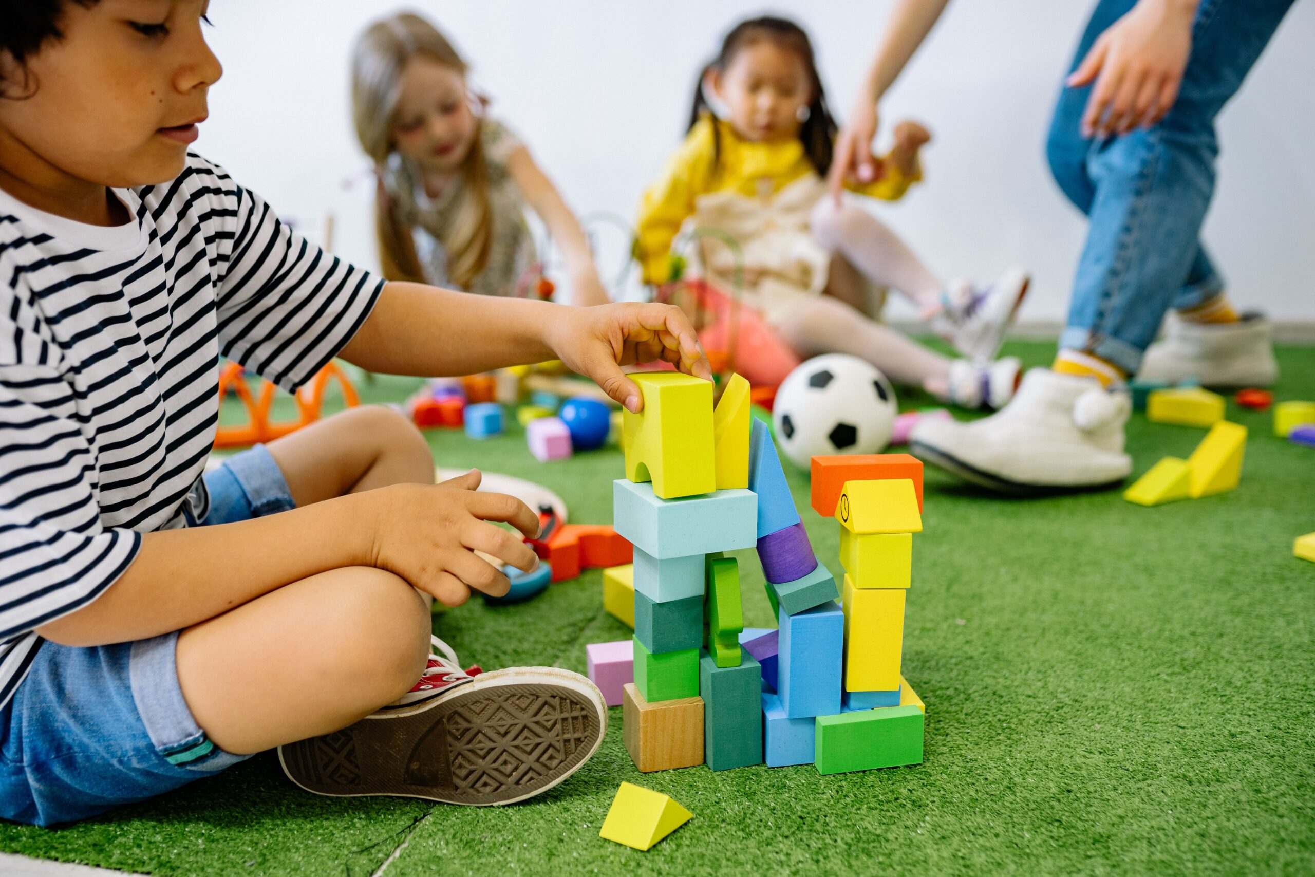 Pediatric occupational therapist guiding children through a play-based activity.
